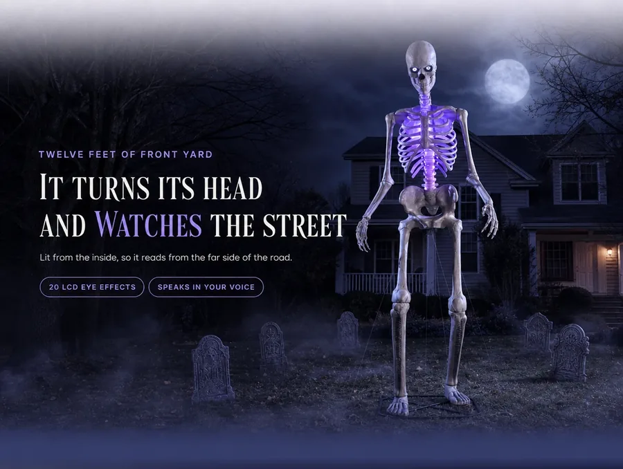 It turns its head and watches the street: twelve feet of front yard, lit from the inside